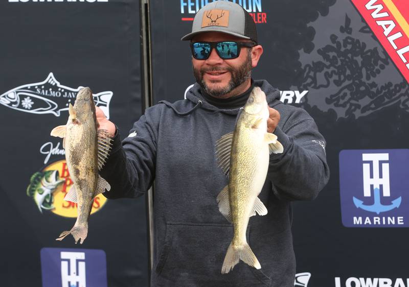 Joe Perez of Spring Valley, holds his fish that he caught during the annual Masters Walleye Circuit tournament on Friday, March 21, 2025 at the Spring Valley Boat Club.