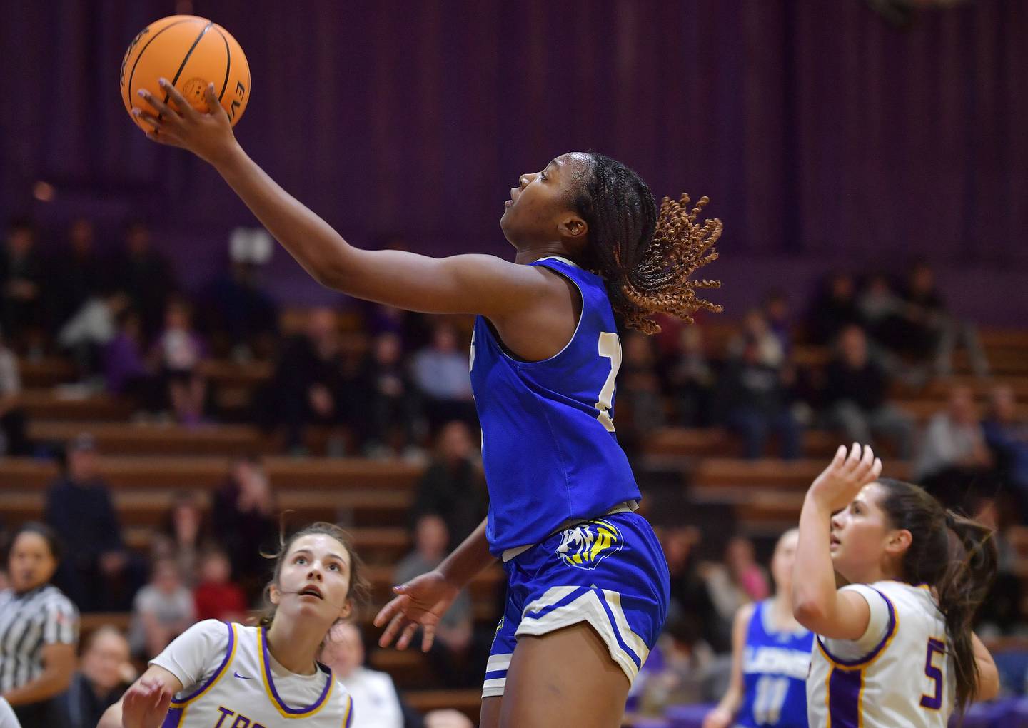 Lyons Township's Nora Ezike takes the ball to the basket during a game against Downers Grove North on December 11, 2024 at Downers Grove North High School in Downers Grove.