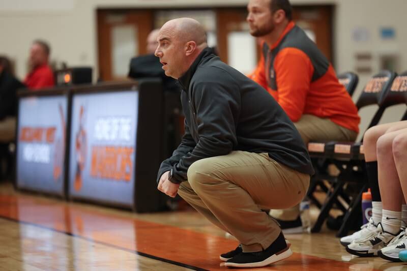 Lincoln-Way West head coach Ryan White keeps an eye on the game against Lincoln-Way Central on Tuesday, February 7th..