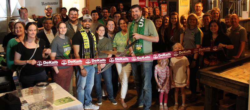 The DeKalb Chamber of Commerce welcoming DeKalb County United with a ribbon-cutting