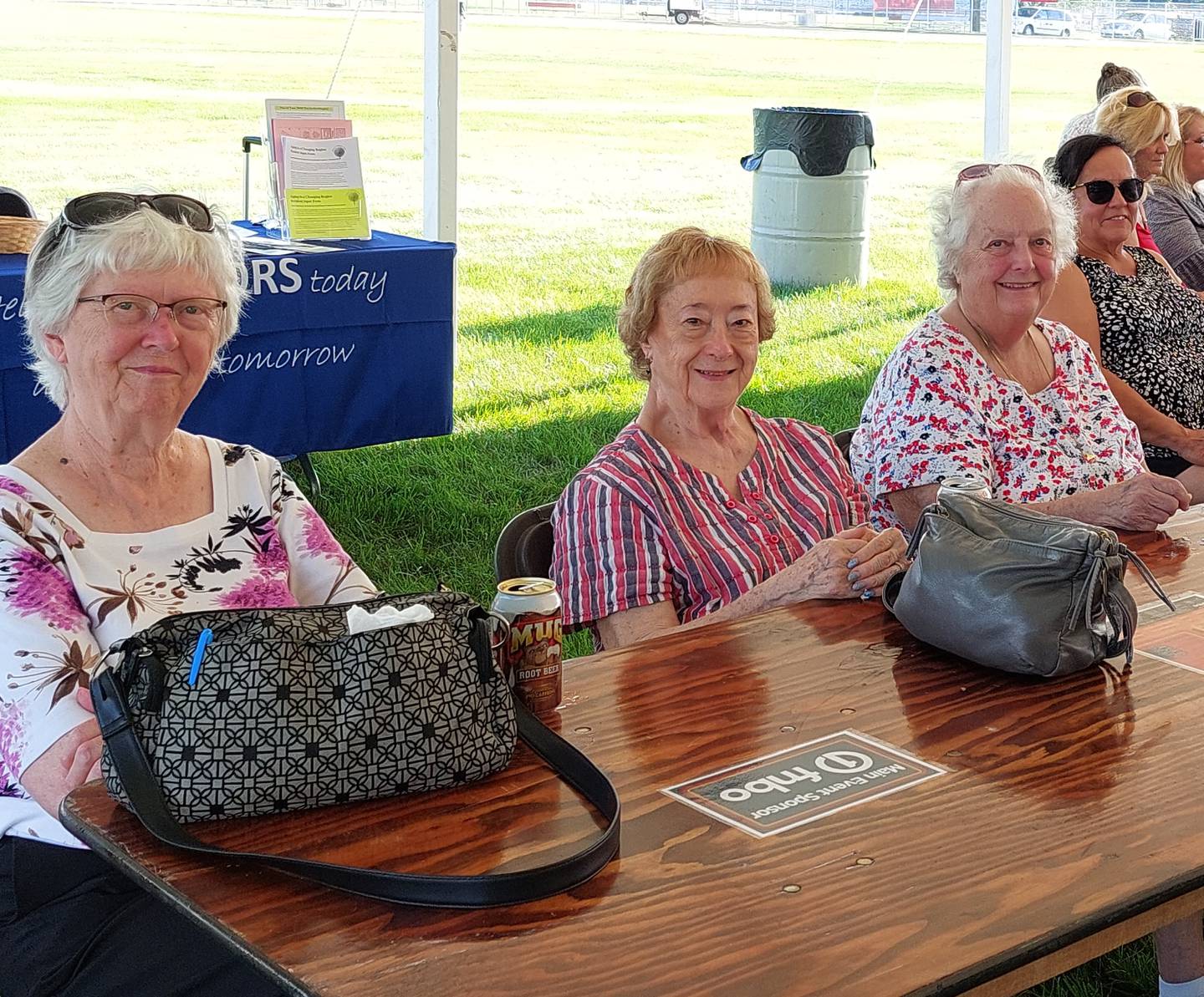 Janice Kiest, Evelyn Tucker and Cindy Metzger enjoy the swinging tunes at the “Big Band & BBQ Event” in Yorkville hosted by Senior Services Associates.