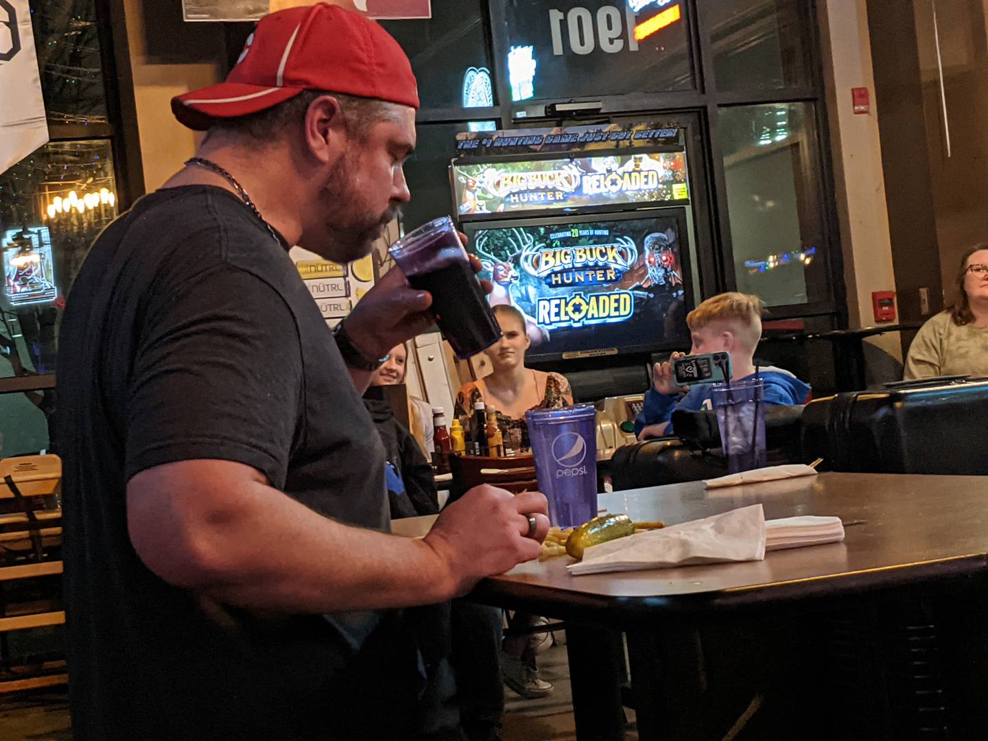 Those at Roadhouse 47 in Yorkville Jan. 26 cheered on professional eater and YouTube star Randy Santel as he dug into the four servings of fries that accompanied the Big Hoss burger.