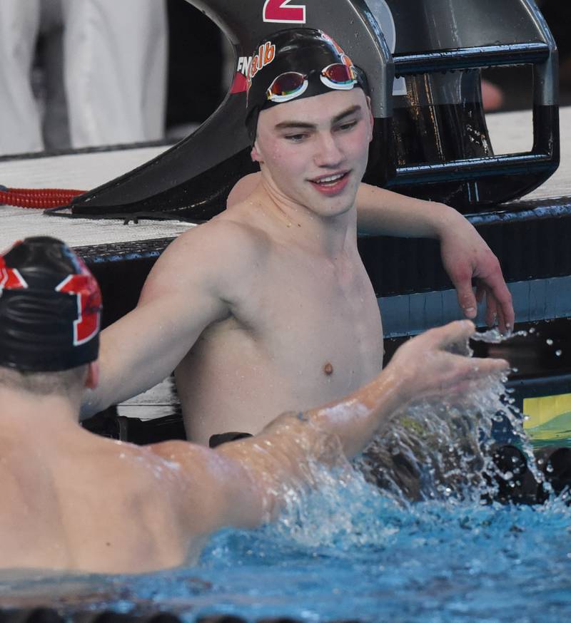 DeKalb’s Jacob Gramer, right, congratulates 50-yard freestyle event winner Dominic Mazurek of Maine South during the boys state swimming and diving finals at FMC Natatorium on Saturday, Feb. 24, 2024 in Westmont.