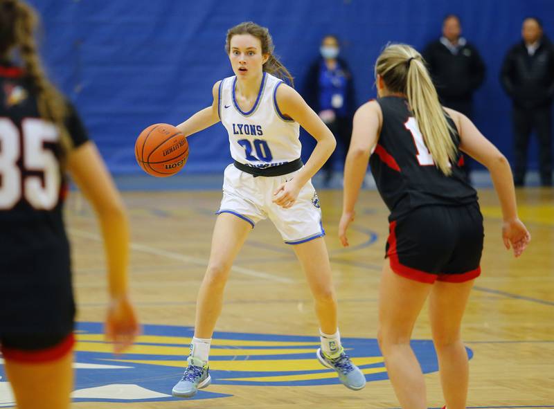 Lyons' Ella Ormsby (20) looks for an opening during the girls varsity basketball game between Benet Academy and Lyons Township on Wednesday, Nov. 30, 2022 in LaGrange, IL.