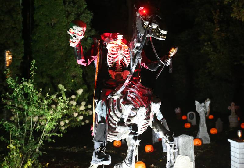 A Halloween headless horseman cover a home in the 800 block of Ottawa Avenue on Thursday, Oct. 17, 2024 in Ottawa.