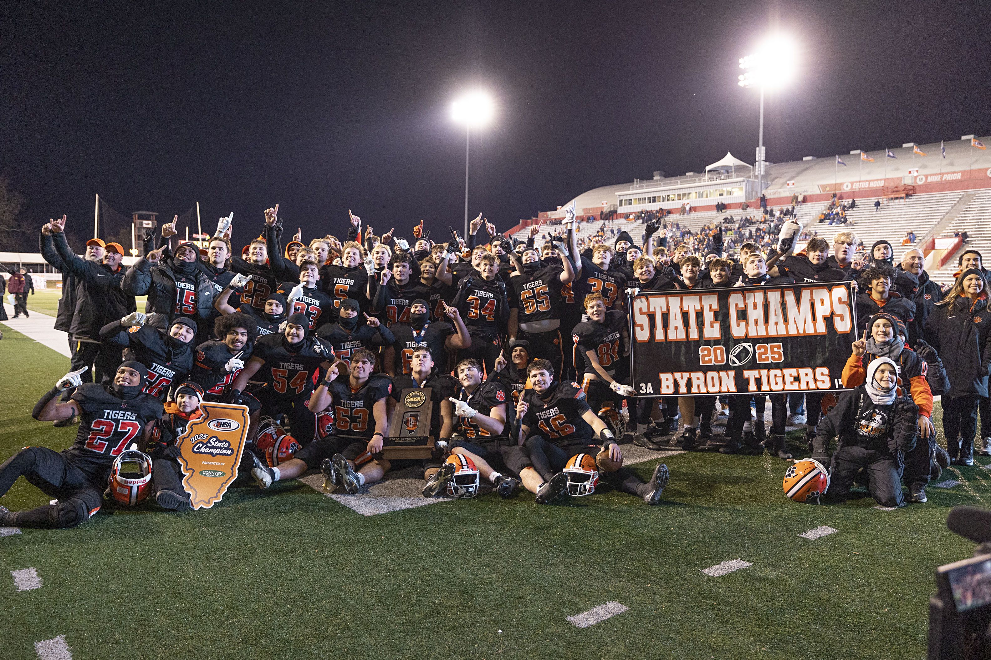 The Byron Tigers celebrate their 56-50 win over Tolono-Unity Friday, Nov. 28, 2025, in the Class 3A football finals at Hancock Stadium at ISU.