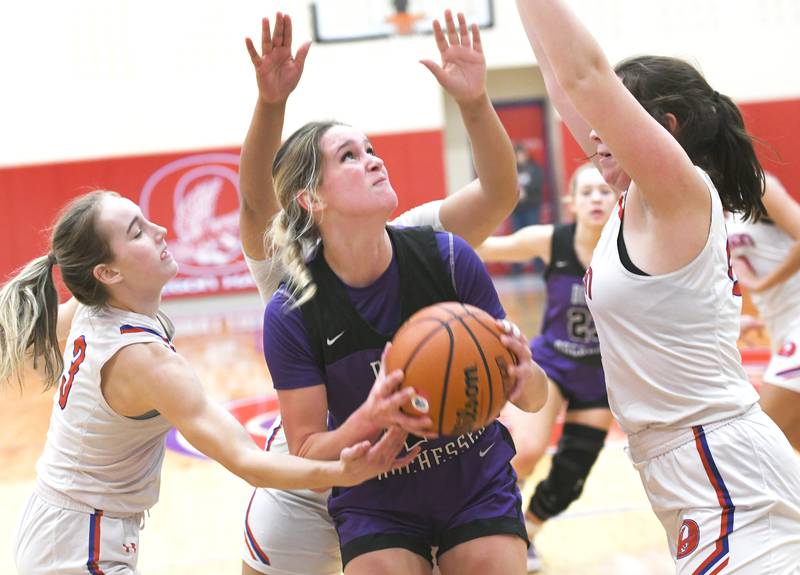 Dixon's Ella Govig (44) looks to shoot while being guarded by three Oregon defenders during Big Northern Conference action at the Blackhawk Center on Saturday, Jan, 21.