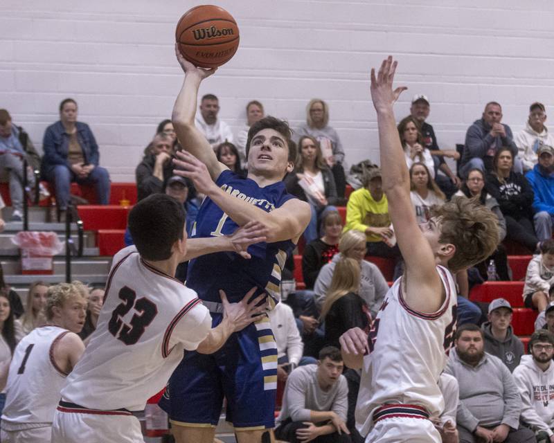 Denver Trainor of Marquette puts up a shot over Woodland's Nick Plesko during the game on January 30, 2024.