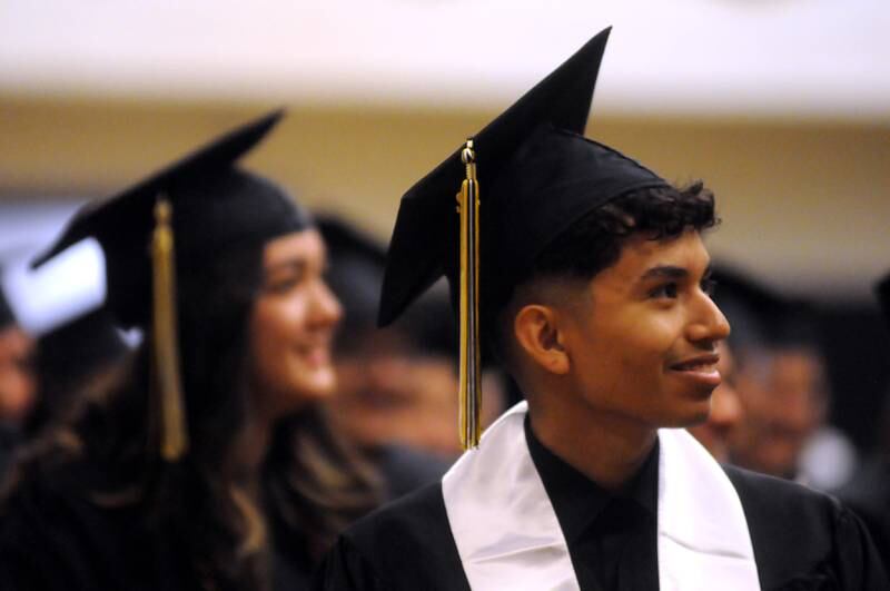 Omar Alexix Alva listens to a speech Sunday, May 22, 2022, during the Harvard High School Commencement Ceremony in Harvard .