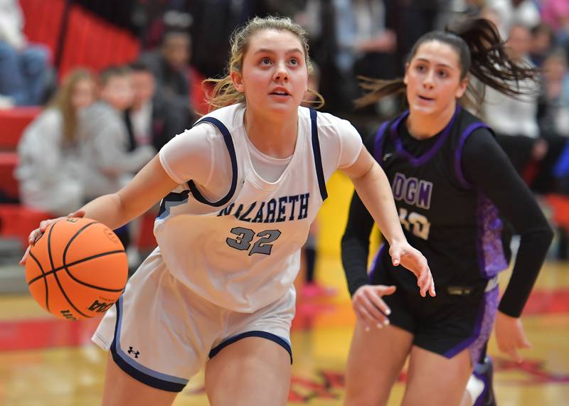 Nazareth’s Stella Sakalas (32) goes to the basket as Downers Grove North’s Campbell Thulin (10)chases during the Class 4A Hinsd ale Central Sectional final game on February 26, 2026 at Hinsdale Central High School in Hinsdale.