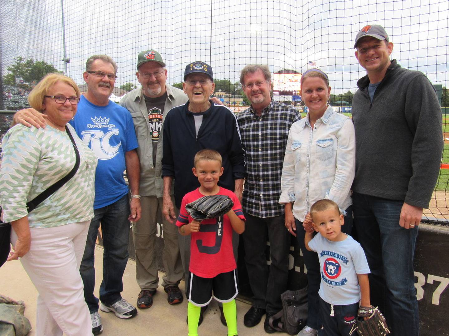 Cheering Glenn Masek on at the Slammers game were daughter-in-law Pat, son Rick, son Mark, Glenn, son Terry, granddaughter Carrie, grandson-in-law John Larson, and, in the front, great-grandsons Jay and Ty Larson.