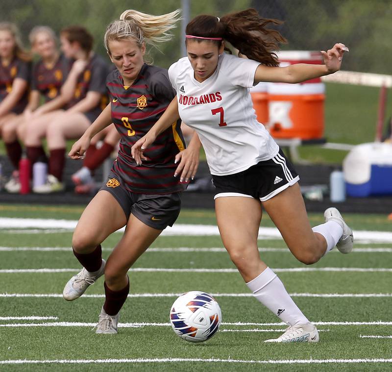 Richmond-Burton's Reese Frericks battles with Woodlands Academy’s Maddie Montez for the ball during a IHSA Division 1 Richmond-Burton Sectional semifinal soccer match Tuesday, May 16, 2023, at Richmond-Burton High School.