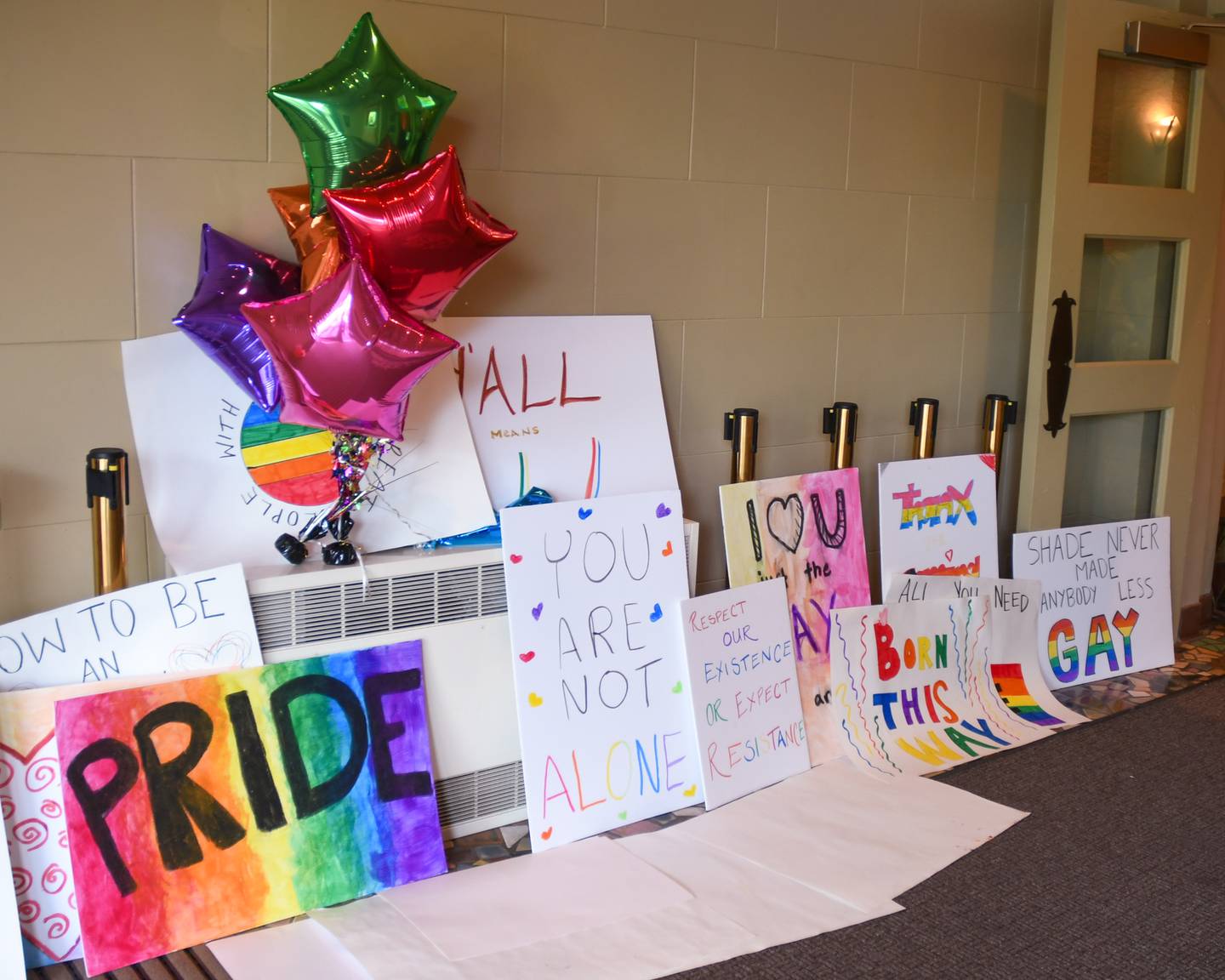 Encouraging signs sit in the foyer of the Egyptian Theater, 135 N. Second St. in downtown DeKalb during the annual DeKalb Pride Fest on Thursday June 22, 2023.