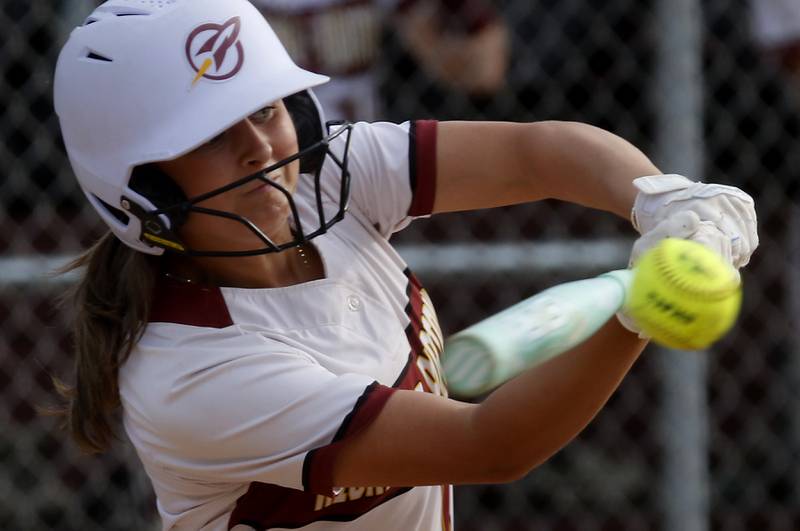 Richmond-Burton's Gracie Johnson connects with the ball during a Kishwaukee River Conference softball game against Marengo on Monday, May 12, 2025, at Richmond-Burton High School in Richmond.