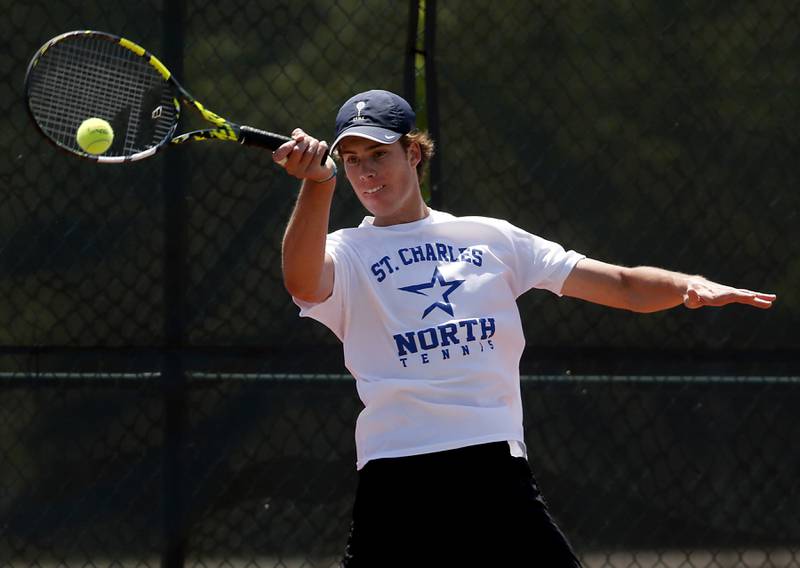 St. Charles North’s Jonathon Spicer returns the ball during an IHSA 2A boys singles tennis match Thursday, May 25, 2023, at Barrington High School.