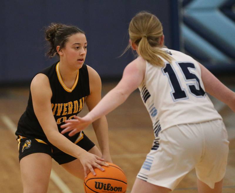 Riverdale's Amarah Coleman looks to pass the ball around Bureau Valley's Brooke Helms during the Thanksgiving Tournament on Wednesday, Nov. 20, 2024 at Bureau Valley High School.