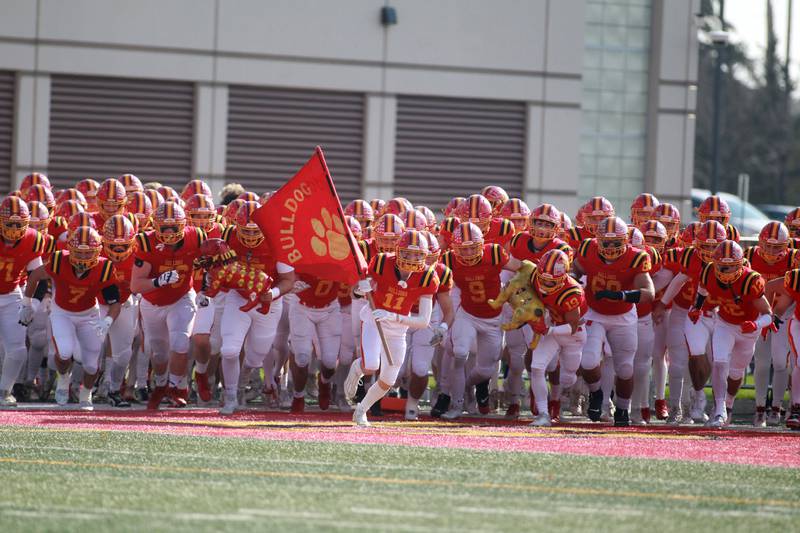 Batavia players take the field for their Class 7A second round playoff game against Lincoln-Way Central in Batavia on Saturday, Nov. 4, 2023.