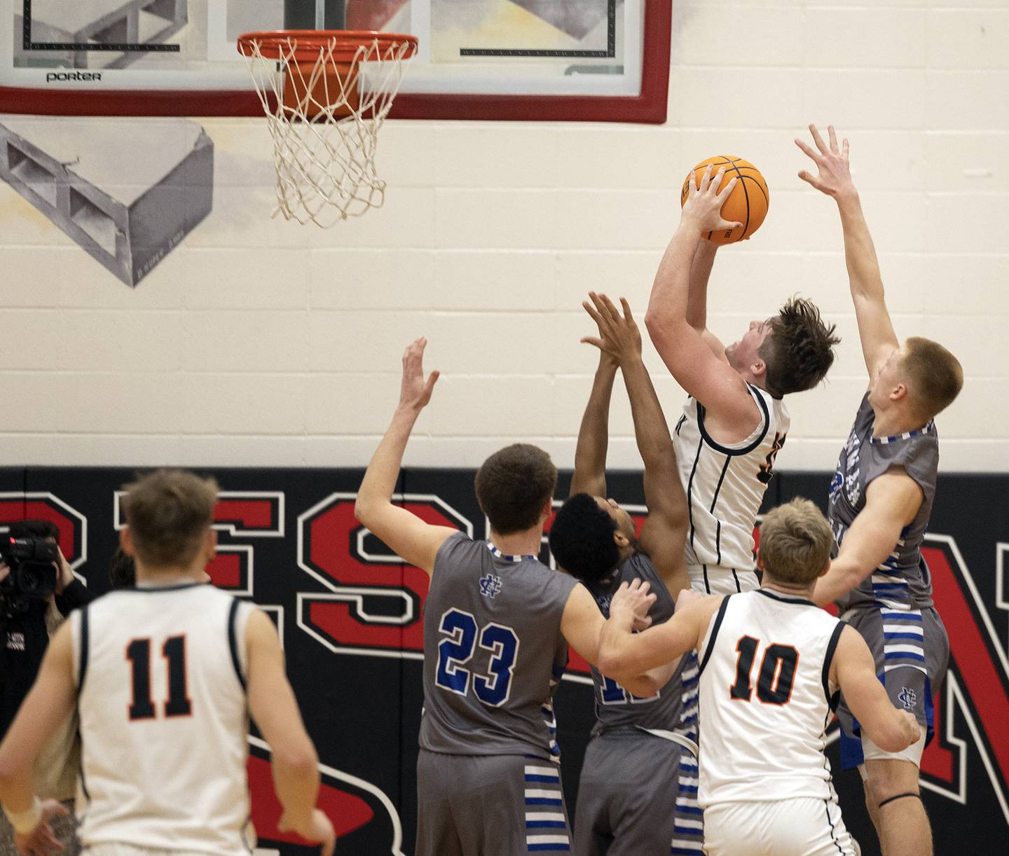 Byron’s Caden Considine put up a shot with one second left against Newman Friday, Dec. 19, 2025, in the Forreston Holiday Tournament title game. The basket fell but just after a timeout was called by the Tigers’ bench. The game went into OT.