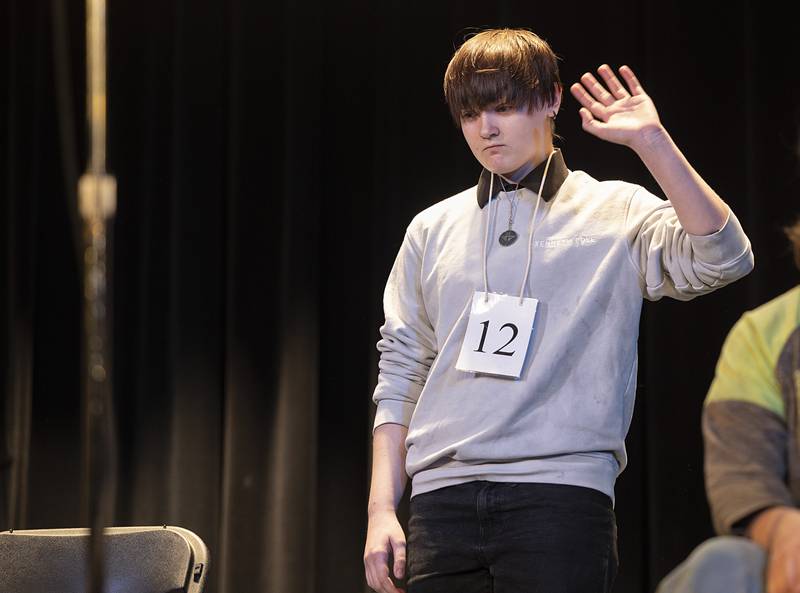 Karley Youngren of Reagan Middle School comes on stage Thursday, Feb. 19, 2026, during the Lee-Ogle-Whiteside County Regional Spelling Bee. Youngren missed in round 1 on the word derby.