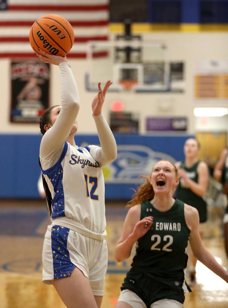 Johnsburg's Addie Graff drives to the basket against St. Edward's Layne Dawson during the IHSA Class 2A Johnsburg Sectional girls basketball championship game on Thursday, February, 26, 2026, at Johnsburg High School.