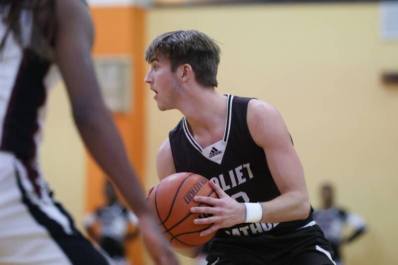 Joliet Catholic’s Tyler Surin looks for a play against Prespectives in the Class 2A Julian Sectional championship on Friday, March 3rd, 2023 in Chicago.