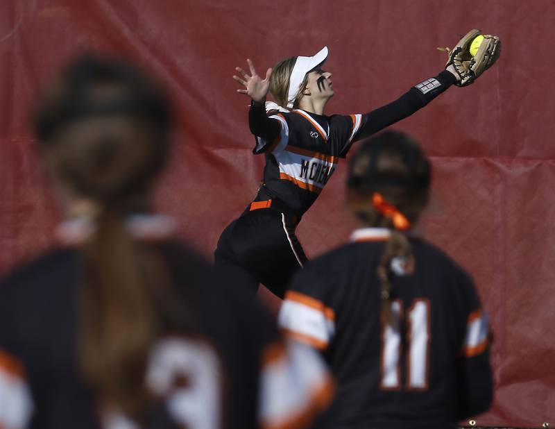 McHenry’s Jadyn Polerecky catches a long fly ball during a non-conference softball game Friday, April 1, 2022, between McHenry and Barrington at Barrington High School.