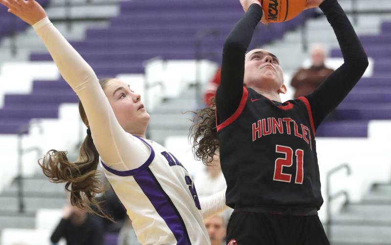 Huntley’s Luca Garlin, right, shoots past Hampshire’s Sadie Van Horn in varsity girls basketball on Wednesday, Feb. 11, 2026, at Hampshire High School in Hampshire.