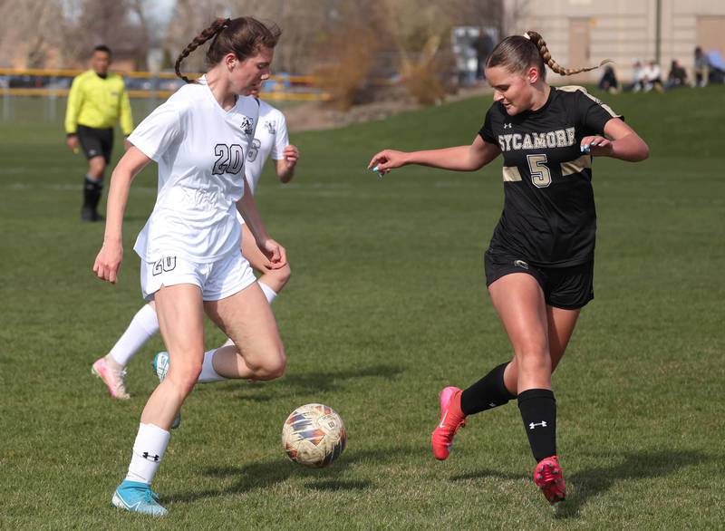 Kaneland's Erin Doucette tries to work past Sycamore's Grace Amptmann during their game Monday, April 14, 2025, at Sycamore High School.
