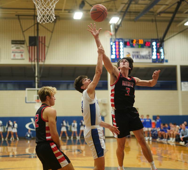 Batavia's Kyle Porter (3) defends against a shot by Geneva’s Gabe Jensen (2) during a basketball game at Geneva High School on Friday, Dec 15, 2023.