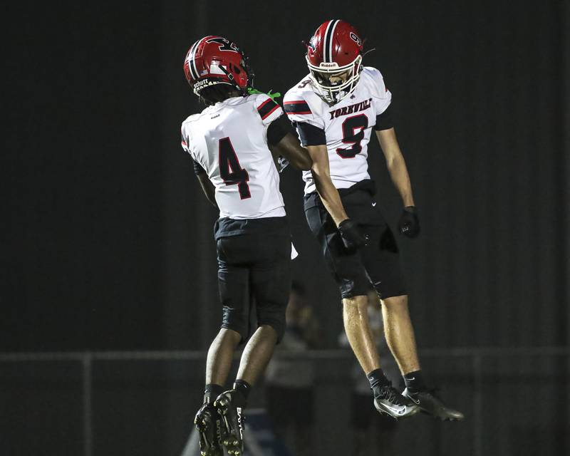Yorkville's A.J. DiVito (9) celebrates his touchdown catch and run during football game between Yorkville at Oswego Friday, Sept 26, 2025 in Oswego.