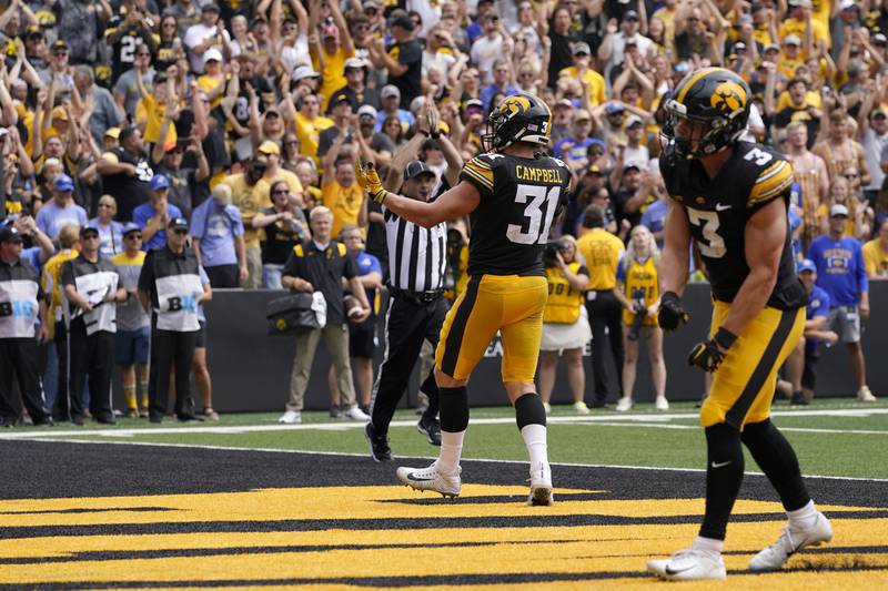 Iowa linebacker Jack Campbell (31) and defensive back Cooper DeJean (3) celebrate after a safety during the second half of an NCAA college football game against South Dakota State, Saturday, Sept. 3, 2022, in Iowa City, Iowa. Iowa won 7-3. (AP Photo/Charlie Neibergall)
