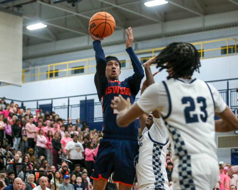 Oswego's Ethan Vahl (3) puts up a shot during their basketball game between Oswego at Oswego East, Feb 13, 2026 in Oswego.