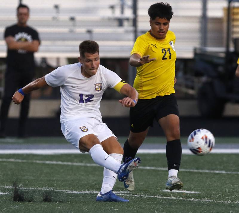 Wauconda's Luka Gmitrovic kicks the ball away from Harvard's Miguel Fuentes during the IHSA Boys Soccer 2A Grayslake Central Sectional semifinal match on Tuesday, Oct. 29, 2024, at Grayslake Central High School,