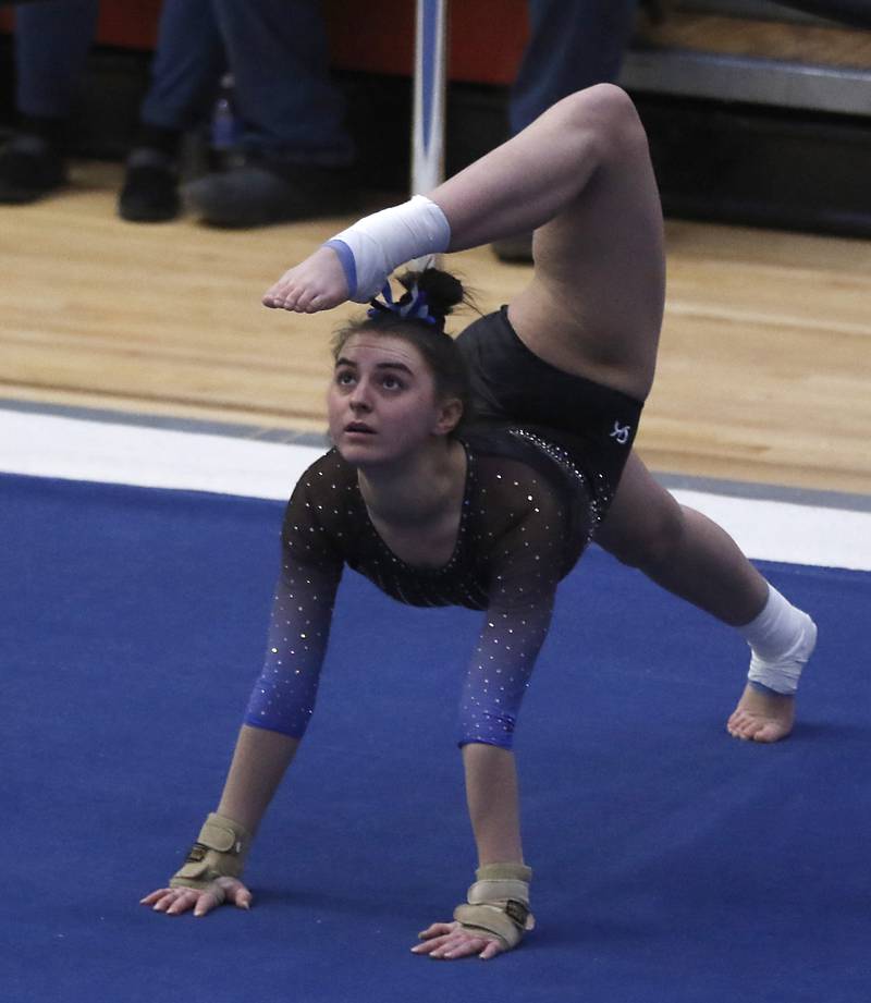 Geneva's Graci Weems competes in the preliminary round of the floor exercise Friday, Feb. 17, 2023, during the IHSA Girls State Final Gymnastics Meet at Palatine High School.