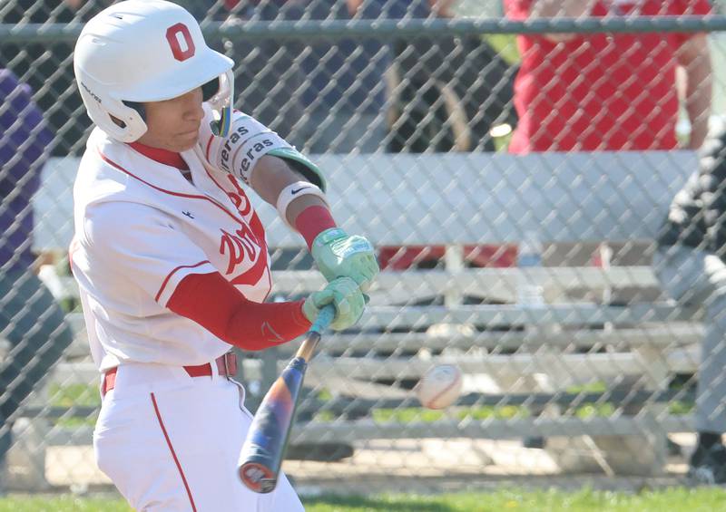 Ottawa's Rizon Contreras gets a hit against Morris on Monday, April 20, 2026 at Ottawa High School.