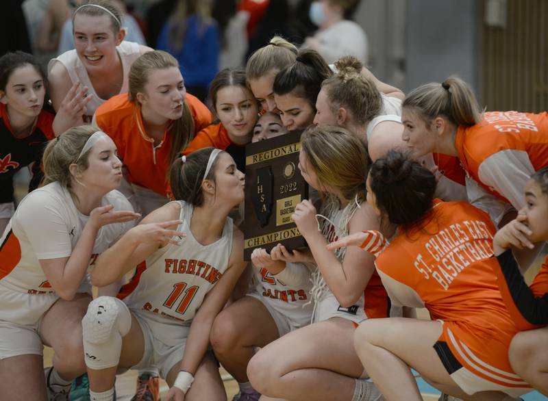 St. Charles East celebrates their victory during their regional game against Willowbrook Thursday Feb. 17, 2022.