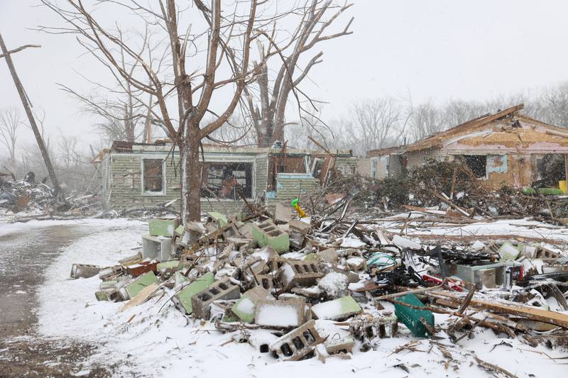 Massive damage is shown to the property of Evanston residents Douglas Weber and Martha Plaza-Weber along South Sandbar Road in Aroma Township on March 16, 2026, following the March 10 tornado in Kankakee County. The home previously had a second story and a garage where the cinder blocks lay.