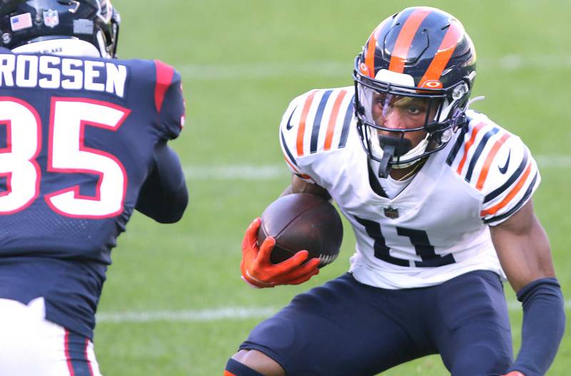 Chicago Bears wide receiver Darnell Mooney (11) looks to make a move on Houston Texans cornerback Keion Crossen (35) during their game Sunday at Soldier Field in Chicago.