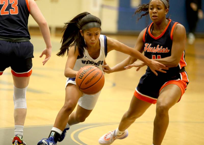 Geneva’s Rilee Hasegawa drives toward the basket during a home game against Naperville North on Tuesday, Nov. 29, 2022.