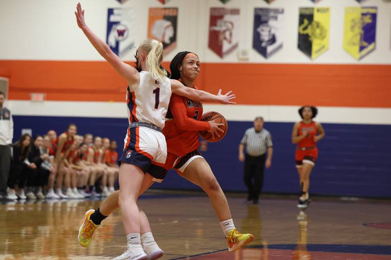 Minooka’s Kennedi Brass drives to the paint against Romeoville on Tuesday January 24th, 2023.