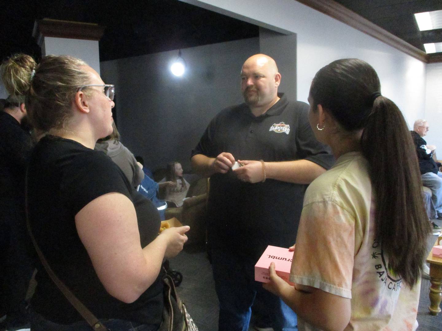 Joliet Slammers' Food and Beverage Director Joel Sigel mingles with guests at an event on Friday when the team provided fans with free samples of food that will be at the ballpark this year. May 3, 2024.