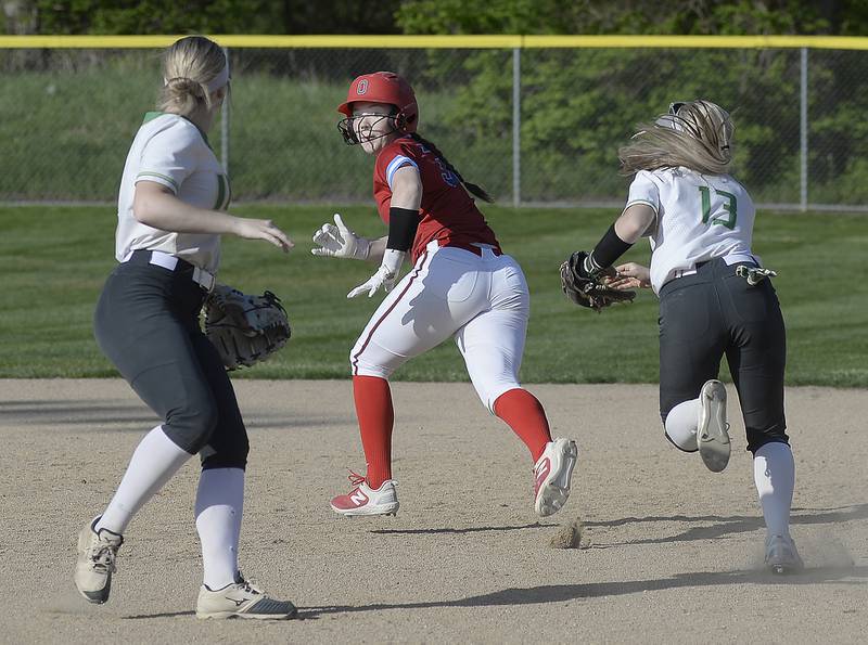 Seneca's Kennedy Hartwig (13) chases after Ottawa baserunner Maura Condon on the basepaths Friday, April 28, 2023, in Ottawa.