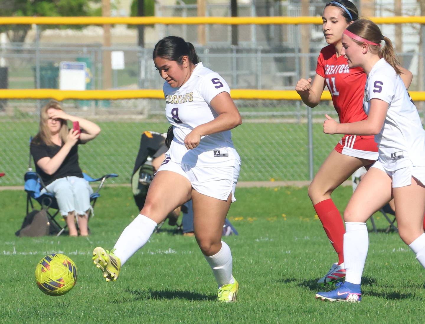Serena/Newark/Earlville's Emma Hernandez kicks the ball ahead of Streator's Briana Chavez on Thursday, April 16, 2026 at the James Street Recreational Complex in Streator.