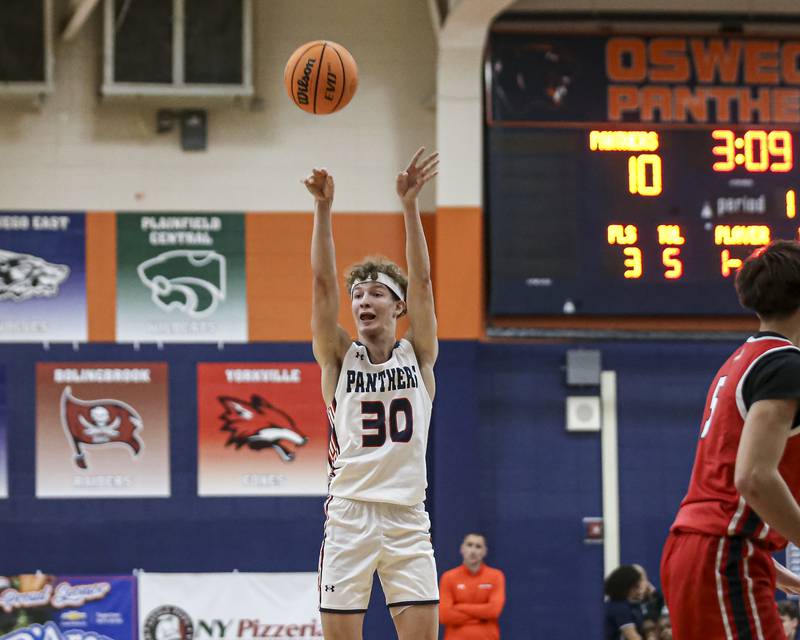 Oswego's Brayden Borrowman (30) shoots a jumper during their basketball game between West Aurora at Oswego Monday, Nov 24, 2025 in Oswego.