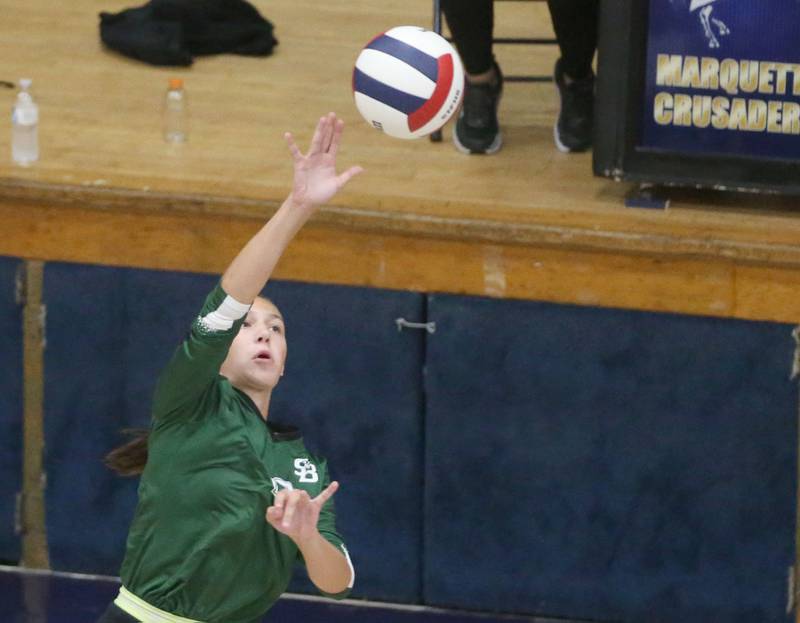 Marquette's Greysyn Carrier reaches up to spike the ball to St. Bede's Lili McClain on Thursday, Sept. 4, 2025 at Bader Gym.