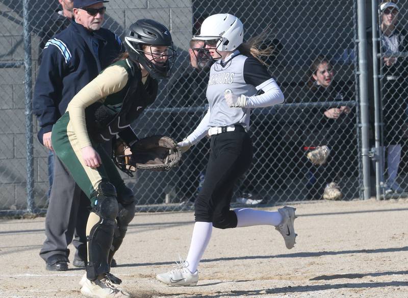 Woodland/Flanagan-Cornell's Jaylei Leninger scores a run as St. Bede catcher Lili McClain waits for the throw on Tuesday, April 8, 2025 at Woodland High School.