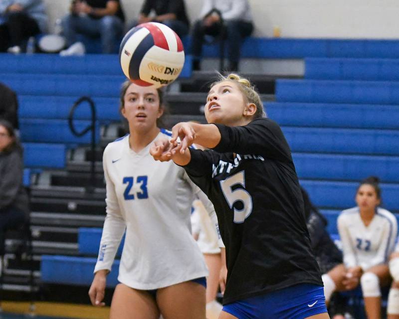 St. Charles North's Meg Kalenowski (5) bumps the ball during the game on Wednesday Oct. 2, 2024, while traveling to take on St. Francis High School in Wheaton.