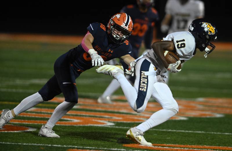 Neuqua Valley’s Daniel Robinson, right, tries to get past Naperville North’s Griffin Jurovec during a football game played on Friday, Oct. 11, 2024 in Naperville.