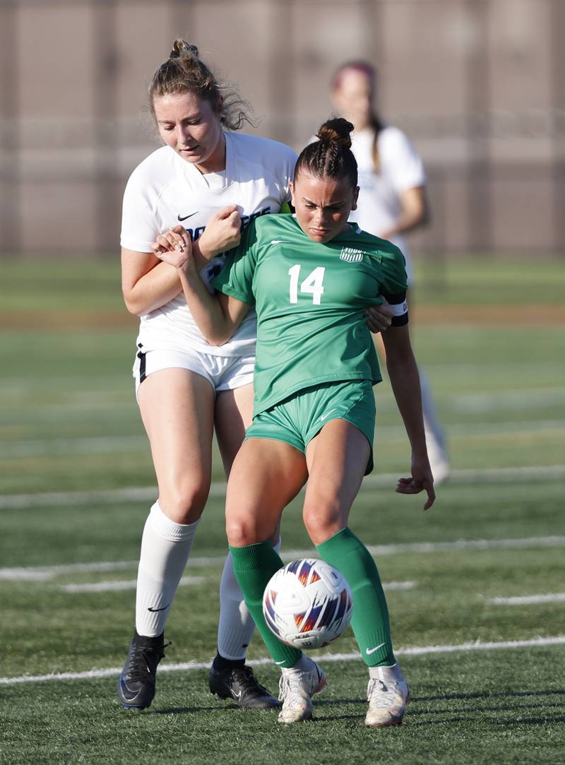 York's Michaela Quinn (14) goes after the ball against Downers Grove South's Ashley Molinari (13) during the Class 3A Morton regional girls soccer final between Downers Grove South and York in Berwyn on Friday, May 17, 2024.