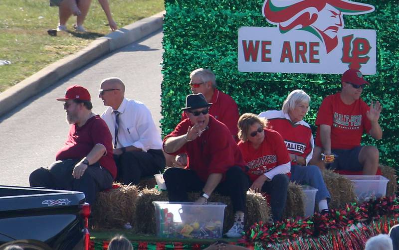 Members of the L-P Board of Education ride a float during the L-P Homecoming parade on Thursday, Sept. 26, 2024 near the corner of 7th Street and Orleans Street in Peru.